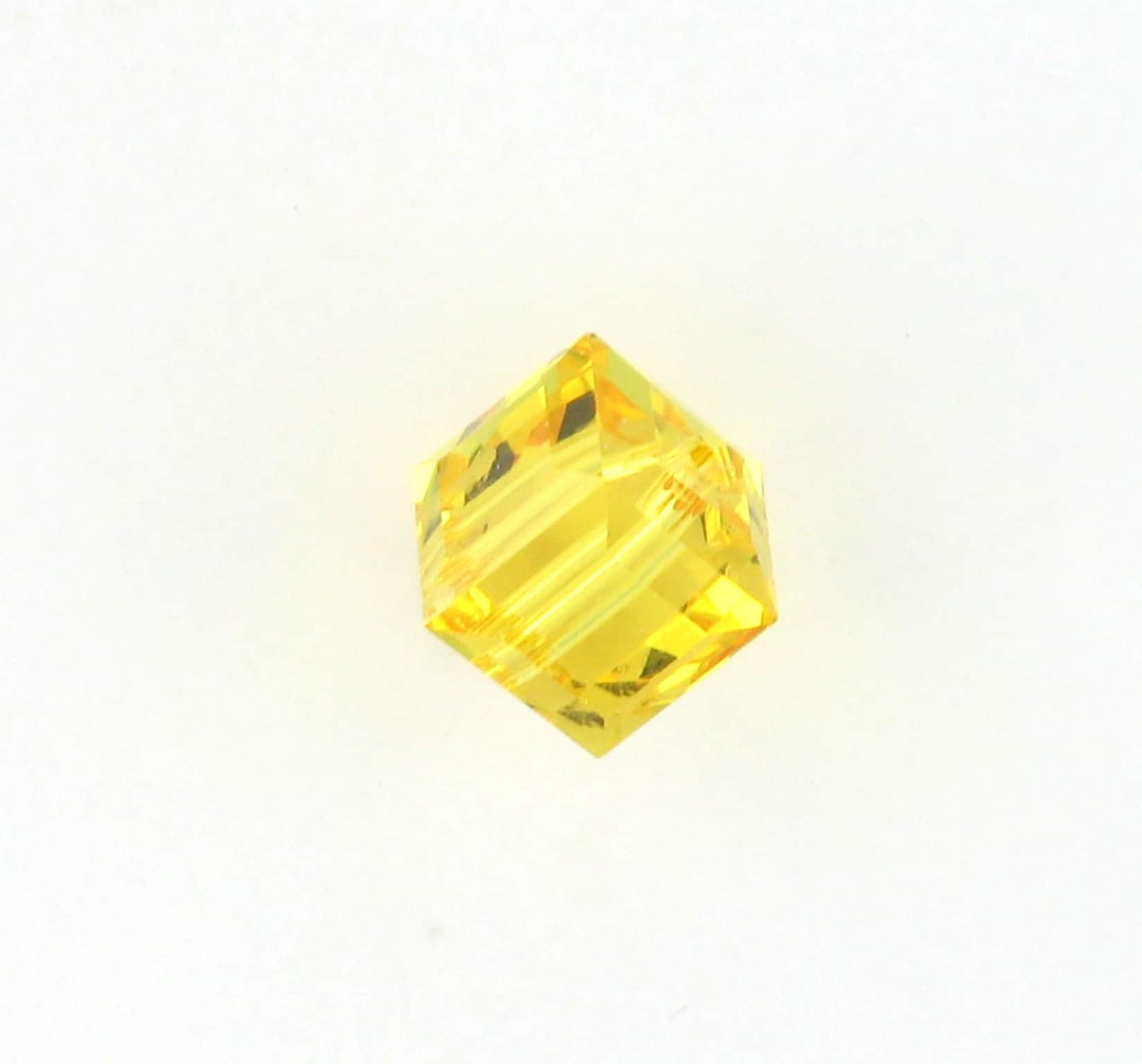 5601 - 4mm Swarovski Cube Crystal - Light Topaz 5601 - 4mm Swarovski Cube Crystal - Light Topaz